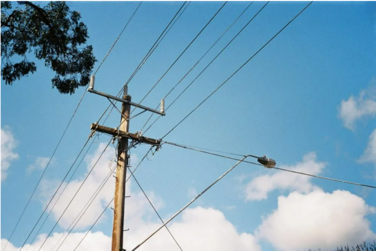 Electrical lines against blue sky